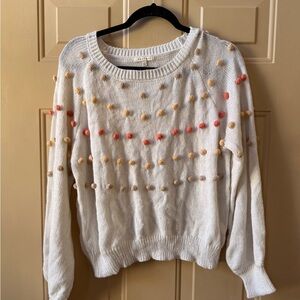 Chic White Sweater with Colorful Pom-Poms